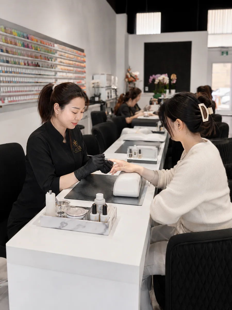 A LeVA technician providing a manicure